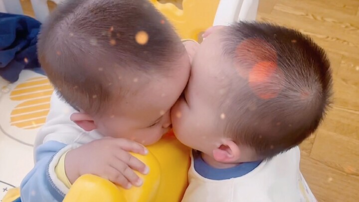 You can't imagine how many times twins can kiss each other in a day~