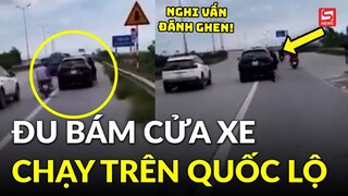 Cô gái mạo hiểm đu bám cửa xe ô tô đang chạy trên quốc lộ và cái kết rùng mình?