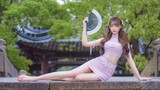 Flowers and the moon. Fantastic dancing by an attractive girl. 