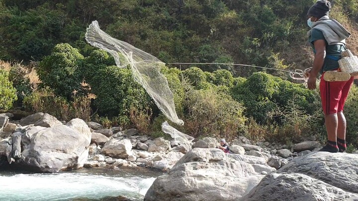 cast net fishing Nepal | cast netting | himalayan trout fishing in Nepal |