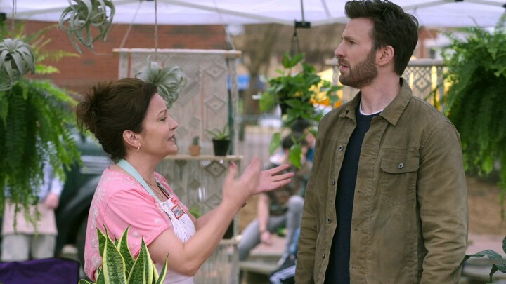 Chris Evans as Cole Turner and Ana de Armas as Sadie Rhodes