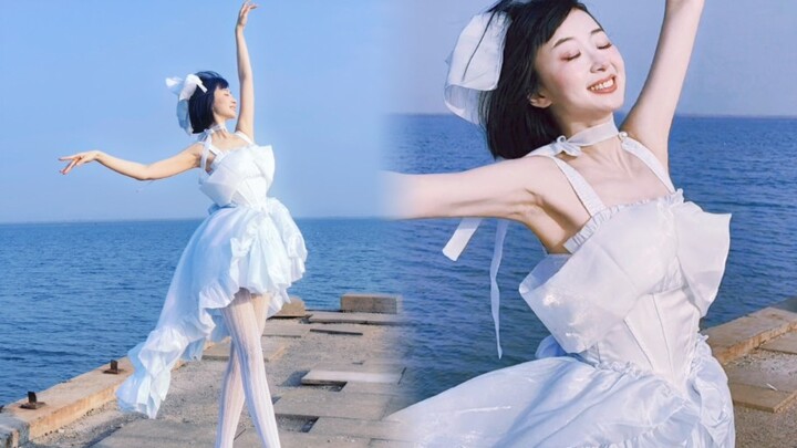 Dancing on the beach. Elegance never goes out of style.