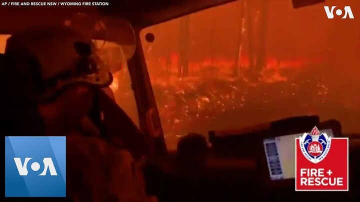 Australia Firefighters Drive Through Inferno
