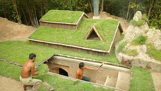 Building underground hut with grass roof & fireplace with clay