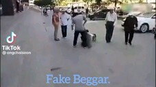 Fake beggar.