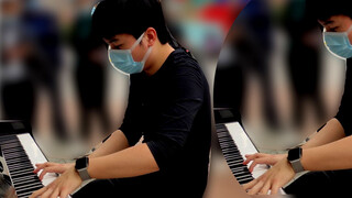 A boy covers "Unravel" with piano in the street