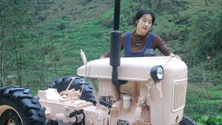 (Lin Guoer) Repairing a 1980 Dongfangfen tractor.