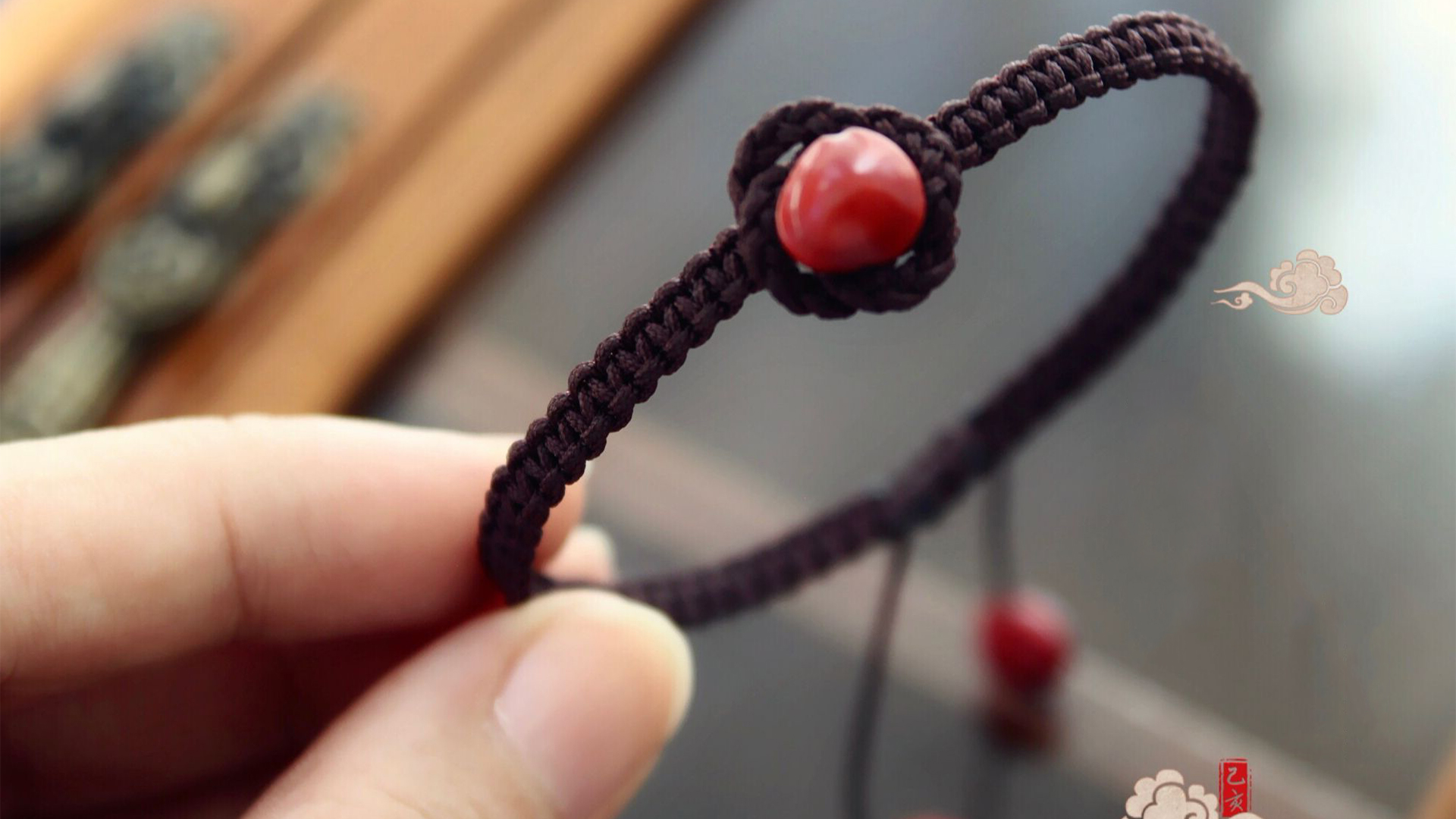 DIYVideo course for making hand strap with jequirity bean  Bilibili