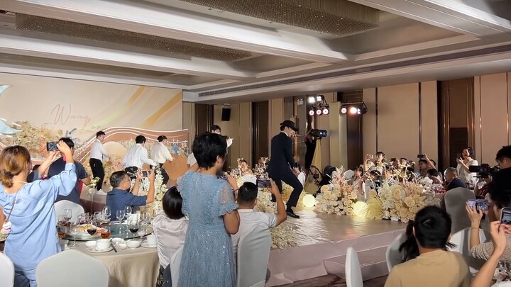 Who knows, family members, dancing to Roar at their brother's EXO-themed wedding