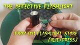 Defective flashlight from Wu Flashlight Store (AliExpress}