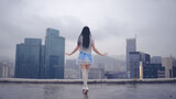 In the pouring rain! Girl dancing on 24-story building rooftop