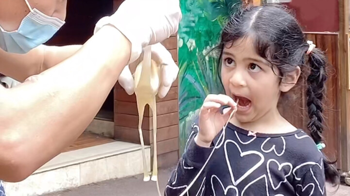 Little Foreign Girl Sees Sugar Figure Blowing Art For The First Time
