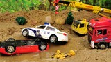 小汽车超速被警车追捕，车辆不慎冲进泥坑，工程车来救援