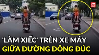 Cho bé gái 'làm xiếc' trên xe máy, tài xế bị dân mạng chỉ trích gay gắt