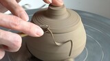 Healing Handmade Pottery | The white ceramic bowl holding small stones is so cute!