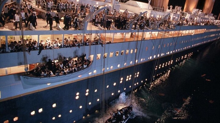Titanic hits an iceberg, extras dive into the water