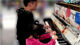 Kover piano "Guren no Hana" oleh seorang anak lelaki di jalan