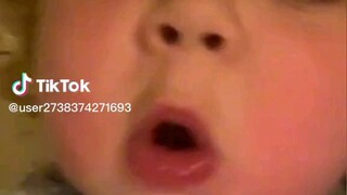 the cute baby is singing