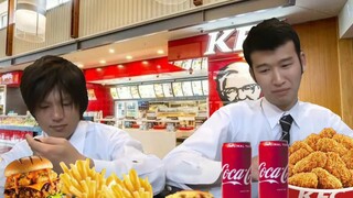 Two people feasting on KFC's Mad Thursday