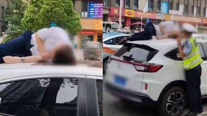 Seorang pria tertidur di atap mobil setelah minum dan dibangunkan oleh polisi lalu lintas di pagi ha