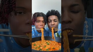 annoying my husband while making spicy noodles