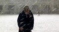 Female college students dance in the snow