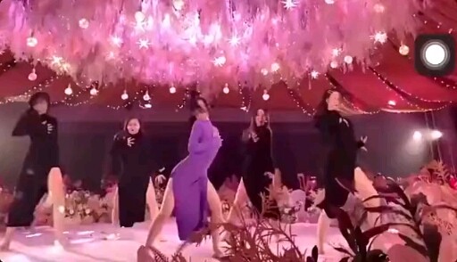 What is the level of dance between the bride and bridesmaids in this wedding?