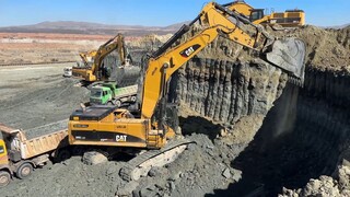 Three Caterpillar 385C And Liebherr 974 Excavators Loading Trucks - Sotiriadis_L