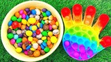 Children learn color mixing rainbow candy and big hand cutting