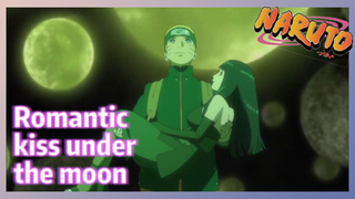 Romantic kiss under the moon