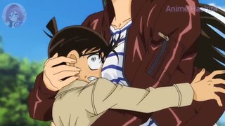 Conan is save by Ran and lost in her chest