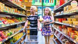 Barbie and Ken bring a baby to the supermarket to buy a milk toy story