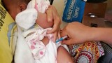 Baby in vaccine