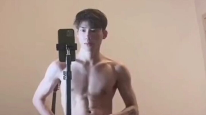 A handsome boy is interviewed by a female reporter
