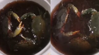 A woman made raw pickled blue crabs, poured a bottle of white wine, marinated them for 4 hours and o