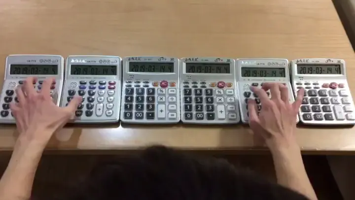 Detective Conan's theme song played on six calculators