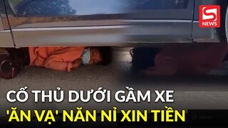 Người phụ nữ cố thủ dưới gầm xe 'ăn vạ', tài xế năn nỉ vẫn không lay chuyển