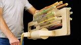 Build a rubber band machine gun out of corrugated paper and hold up to 120 rubber bands!