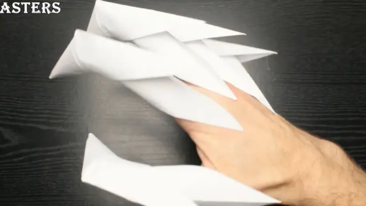 Make a dragon's claw out of a few sheets of white paper!