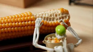 [Stop Motion Animation] Small skeletons break corn kernels at a slow speed with high energy, make ho