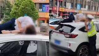 男子酒后在车顶睡着，早上迷迷糊糊被交警唤醒：这哥们儿素质极高