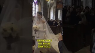 Kim Dong Wook and his wife sharing a kiss at the wedding