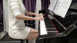 "Croatian Rhapsody" was covered by a woman in white sweater with piano
