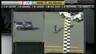 Carl Edwards runs across finish line