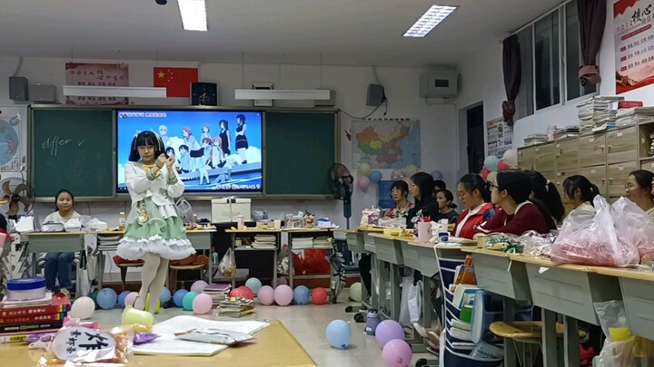A senior high school student dancing to the rainbow-colored passions in class