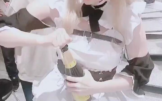 Cosplay girls show open wine by hand