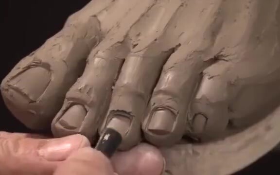 Making clay sculpture hands and feet
