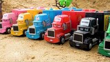 There are trucks in various colors, excavators, construction vehicles, and cute trucks sleeping in t