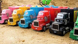 There are trucks in various colors, excavators, construction vehicles, and cute trucks sleeping in t