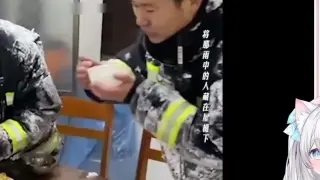 Japanese white cat touched by Chinese firefighters